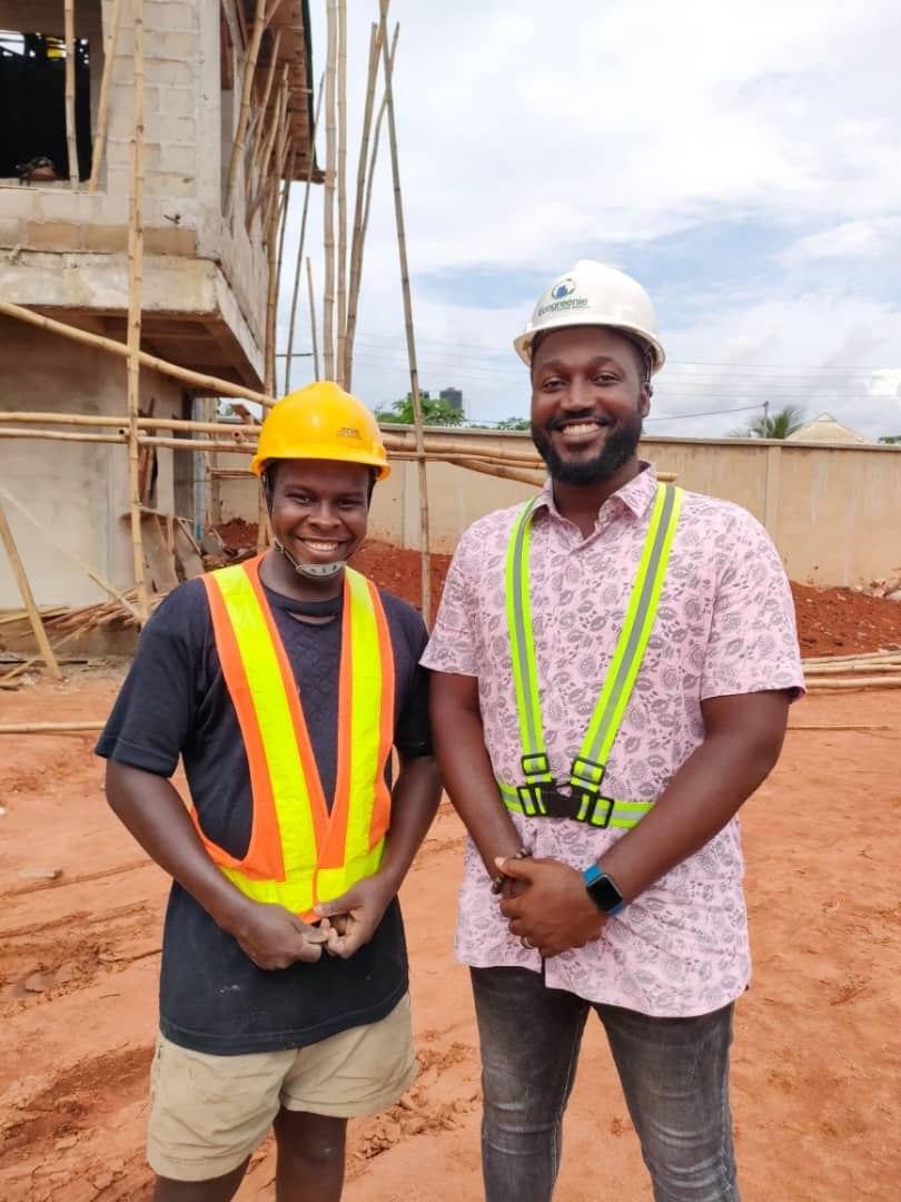 Dr. Anya Daniel K. on a construction site wearing an Ecogreenie hard hat